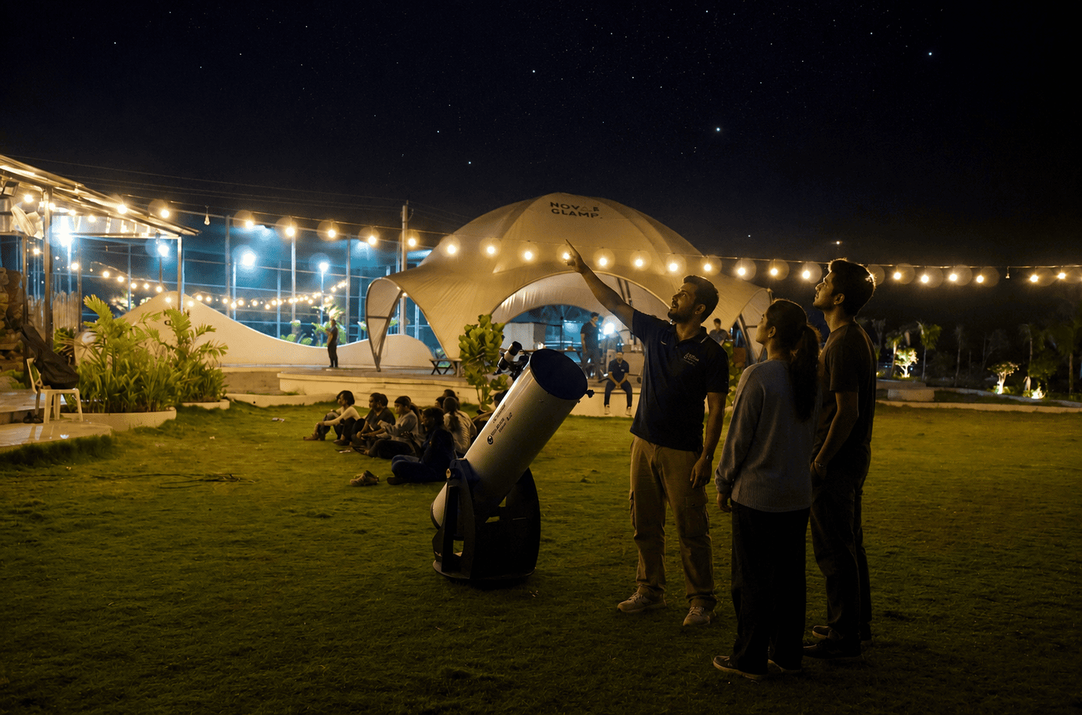 Couple stargazing together at Novae Glamp near Hyderabad