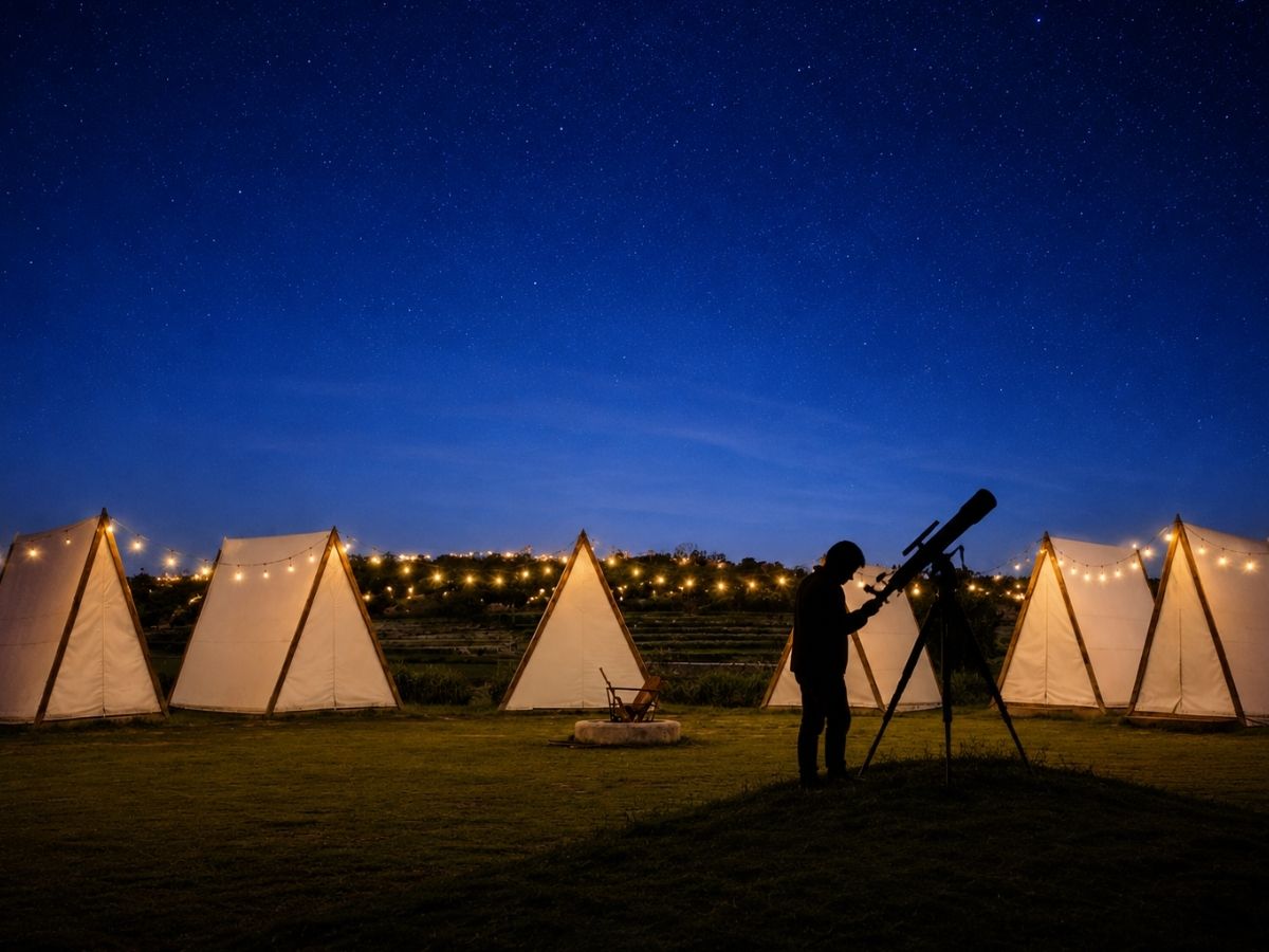 Guest using telescope for stargazing at Novae Glamp near Hyderabad