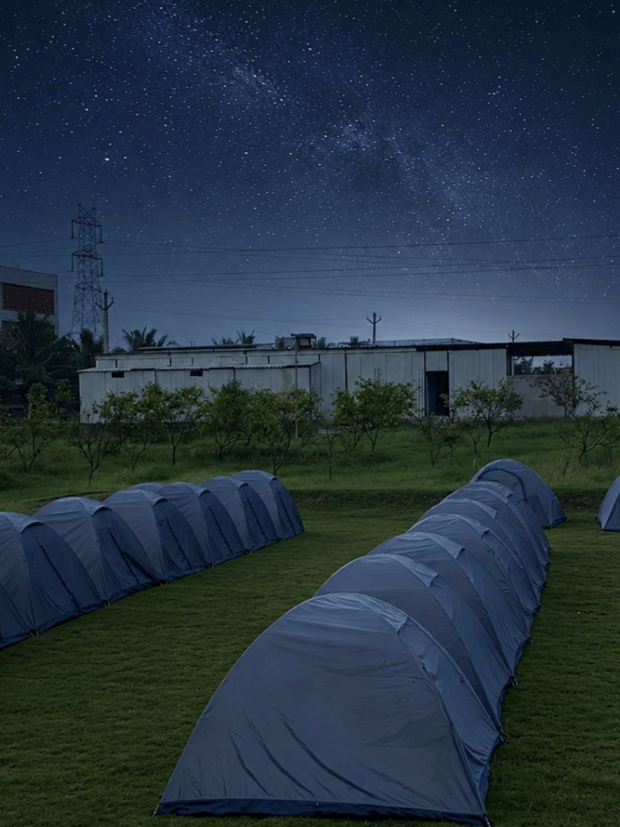 Camping tents under dark starry sky at Novae Glamp near Hyderabad