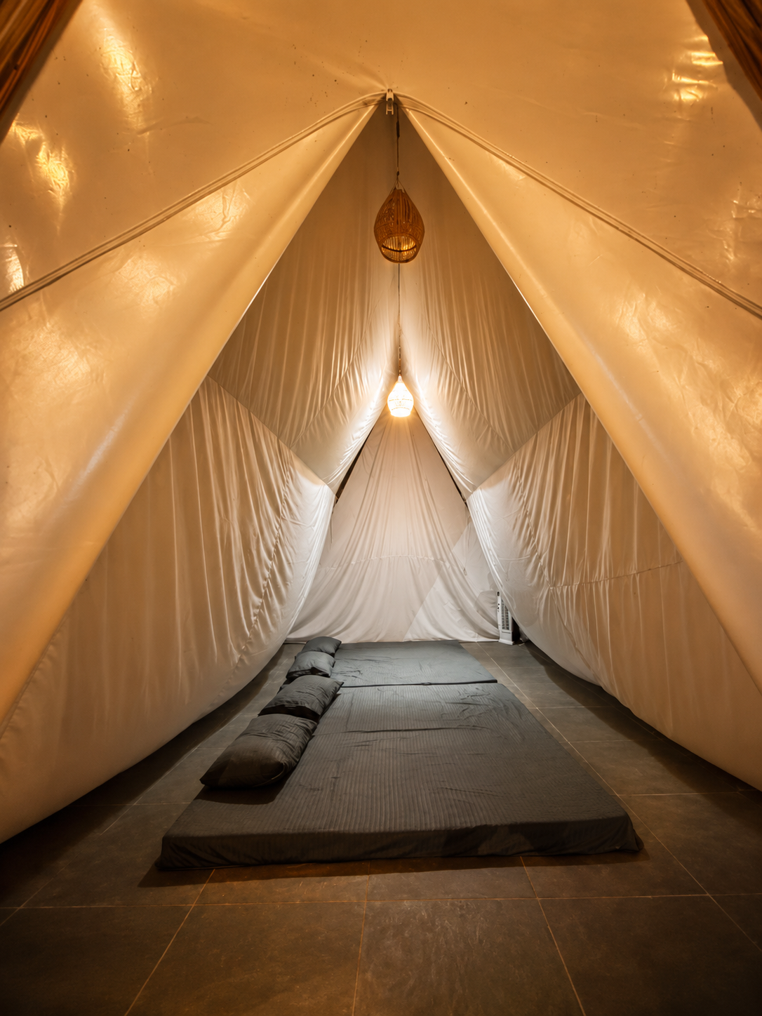 Inside hut tent accommodation at Novae Glamp near Hyderabad